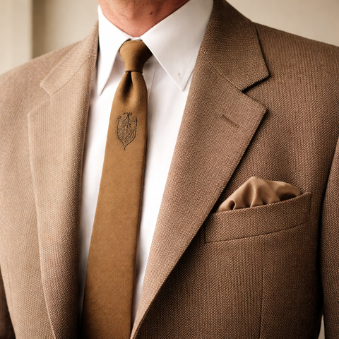 1950s Golden Brown Silk Skinny Tie Narrow Mid Century Men's Vintage All Silk Necktie with embroidered shield design by Beau Brummell